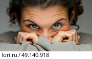 A woman is covering her face with her hands, hiding her expression from view. Стоковое AI-изображение, AI-художник Данила Большаков / Фотобанк Лори