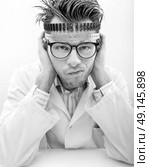 Portrait of a disappointed young technician. Стоковое фото, агентство Ingram Publishing / Фотобанк Лори