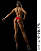 Young fitness girl isolated on black. Стоковое фото, агентство Ingram Publishing / Фотобанк Лори