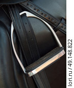 stirrup at dressage saddle. close up. Стоковое фото, агентство Ingram Publishing / Фотобанк Лори