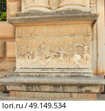 Alhambra, wall of Carlos V Palace. Relief carving of a battle scene. . Стоковое фото, агентство Ingram Publishing / Фотобанк Лори