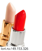 Red  and nude lipstickes  over white background. Стоковое фото, агентство Ingram Publishing / Фотобанк Лори