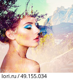 Portrait of beautiful sensual woman with elegant hairstyle.  Fashion photo. Double exposure portrait of woman combined with photograph of nature. Стоковое фото, агентство Ingram Publishing / Фотобанк Лори