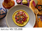Humus with marinated tuna Moroccan recipe on wooden table. Стоковое фото, агентство Ingram Publishing / Фотобанк Лори