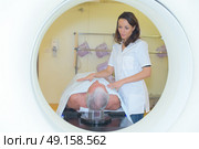 Nurse with patient going into MRI scanner. Стоковое фото, агентство Ingram Publishing / Фотобанк Лори