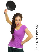 Young angry woman the chef isolated. Стоковое фото, агентство Ingram Publishing / Фотобанк Лори