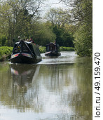 Two canal boats making their way along the river. Стоковое фото, агентство Ingram Publishing / Фотобанк Лори