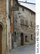 Exterior stone walls of houses in town, Radda in Chianti, Tuscany, Italy. Стоковое фото, агентство Ingram Publishing / Фотобанк Лори