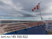 Canadian flag on MV Fundy Rose, Bay of Fundy, Saint John, New Brunswick, Canada. Стоковое фото, агентство Ingram Publishing / Фотобанк Лори