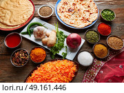 Coconut rice indian recipe food served with spices and Papadam. Стоковое фото, агентство Ingram Publishing / Фотобанк Лори