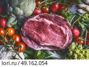 Raw meat and various vegetables: Artichokes  , tomatoes,broccoli, asparagus, cauliflower, top view, close up, copy space. Стоковое фото, агентство Ingram Publishing / Фотобанк Лори