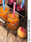 Smoothies with apricot and currant. Freshly blended smoothies with ripe apricot and currant berries. Стоковое фото, агентство Ingram Publishing / Фотобанк Лори