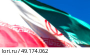 in iran blur  iranian waving flag  the blue sky and wind. Стоковое фото, агентство Ingram Publishing / Фотобанк Лори