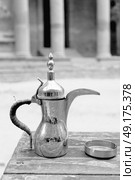 in the site of petra jordan the traditional coffe container isolated on a table. Стоковое фото, агентство Ingram Publishing / Фотобанк Лори