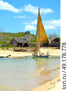 pirogue beach seaweed in indian ocean madagascar  people   sand isle      sky    and rock. Стоковое фото, агентство Ingram Publishing / Фотобанк Лори
