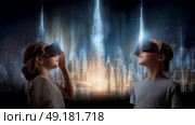 Child using virtual reality headset for metaverse, child looking into VR glasses. Little girl boy with futuristic glasses having fun, teenager playing video games. Technology, simulator, oculus future. Стоковое AI-изображение, AI-художник ALLA YURTAYEVA / Фотобанк Лори
