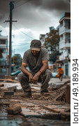 A man squats down in the center of a busy street, surrounded by cars and pedestrians. Стоковое AI-изображение, AI-художник Данила Большаков / Фотобанк Лори