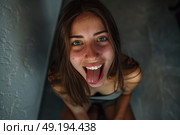 A woman with a surprised expression, mouth agape, eyes wide open in astonishment. Стоковое AI-изображение, AI-художник Данила Большаков / Фотобанк Лори