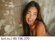 A beautiful young woman playfully sticking her tongue out. Стоковое AI-изображение, AI-художник Данила Большаков / Фотобанк Лори