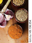 Spices and herbs in ceramic bowls. Food and cuisine ingredients. Colorful natural additives. Стоковое фото, агентство Ingram Publishing / Фотобанк Лори