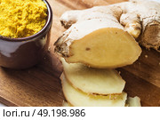 Spices and herbs in ceramic bowls. curcuma and ginger seasoning. Colorful natural additives. Стоковое фото, агентство Ingram Publishing / Фотобанк Лори
