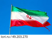 in iran iranian waving flag  the blue sky and wind. Стоковое фото, агентство Ingram Publishing / Фотобанк Лори