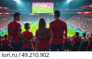 A portrait of a family at a fan zone, parents and children all wearing matching jerseys, their faces lit by the glow of a giant screen showing a sport game. Стоковое AI-видео, аниматор Sergey Grishin / Фотобанк Лори