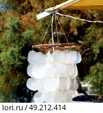 full in market old table shell and sealife in sale chandelier. Стоковое фото, агентство Ingram Publishing / Фотобанк Лори