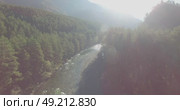 Low altitude flight over fresh fast mountain river with rocks at sunny summer morning. Стоковое видео, видеограф Александр Маркин / Фотобанк Лори