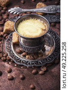 Coffee in the oriental style. Vintage set with a cup of coffee on saucer in oriental style. Стоковое фото, агентство Ingram Publishing / Фотобанк Лори