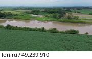 Dredging Machinery Operating in the Cauca River Seen From Drone. Стоковое видео, видеограф ALEJANDRO PEREZ ALVARES / Фотобанк Лори