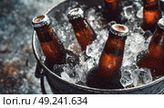 A bucket of ice with several brown beer bottles, close-up. Стоковое AI-изображение, AI-художник Ярославский Максим / Фотобанк Лори