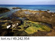 rock stone sky cloud beach  water  coastline and summer in lanzarote spain. Стоковое фото, агентство Ingram Publishing / Фотобанк Лори