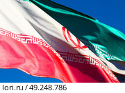 in iran blur  iranian waving flag  the blue sky and wind. Стоковое фото, агентство Ingram Publishing / Фотобанк Лори