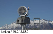 Snow Cannon Maintenance Alps Winter: Technician inspecting snowmaking equipment atop snowy mountains for optimal performance. Стоковое видео, видеограф svetograph / Фотобанк Лори