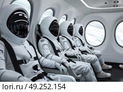 Astronauts in spacesuits sit in a row atop an airplane fuselage, ready for a space mission. The aircraft serves as a platform for final preparations before launch. Стоковое AI-изображение, AI-художник Данила Большаков / Фотобанк Лори