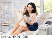 woman gazes at herself in mirror. Стоковое фото, фотограф Яков Филимонов / Фотобанк Лори