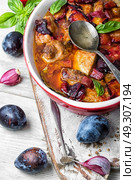 meat goulash in plum sauce. dish of pork stewed in plum sauce. Стоковое фото, агентство Ingram Publishing / Фотобанк Лори