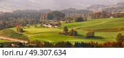 Panoramic view of beautiful mountain rural landscape in Alps with village in the backgroundFantastic views of Austrian green hills. Beauty world. Colorful mountain landscape of austrian alps in Mondsee. Стоковое фото, агентство Ingram Publishing / Фотобанк Лори