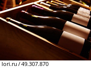 Wine Cellar from Mediterranean with bottles stacked in rows. Стоковое фото, агентство Ingram Publishing / Фотобанк Лори