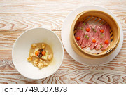 Iberian pork ham with XO sauce and cabbage stew with pork rinds. Стоковое фото, агентство Ingram Publishing / Фотобанк Лори