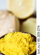 Spices and herbs in ceramic bowls. curcuma and ginger seasoning. Colorful natural additives. Стоковое фото, агентство Ingram Publishing / Фотобанк Лори