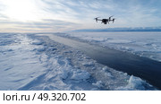 Thermal drone scanning vast icy terrain in Arctic survey. Life in permafrost conditions, climate change problems on the planet. Global warming. Стоковое AI-изображение, AI-художник ALLA YURTAYEVA / Фотобанк Лори