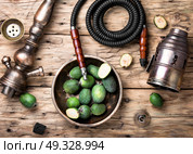oriental nargile with feijoa. hookah with a tobacco flavor of a feijoa. Стоковое фото, агентство Ingram Publishing / Фотобанк Лори