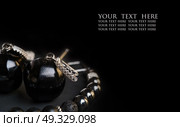 jewel handmade bracelet with semipreciouse stones and earrings with black  semiprecious gem jet and fianitat black background. Стоковое фото, агентство Ingram Publishing / Фотобанк Лори
