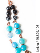 jewerly bracelet  with chalcedony and obsidian around white background. Стоковое фото, агентство Ingram Publishing / Фотобанк Лори