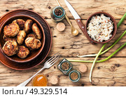 meat homemade cutlets. Homemade cutlets in clay ware on plate.Ukrainian home food. Стоковое фото, агентство Ingram Publishing / Фотобанк Лори
