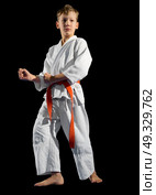 Boy martial arts fighter isolated. Стоковое фото, агентство Ingram Publishing / Фотобанк Лори