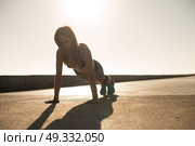 Fitness woman doing exercices on summer sunset. Стоковое фото, агентство Ingram Publishing / Фотобанк Лори