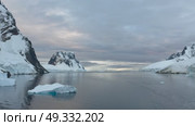 Big Iceberg in Antarctica Winter Scenery, Amazing Shape Ice Formation of Massive Large Enormous Blue Icebergs in Antarctic Peninsula Landscape Seascape with Ocean Sea Water. Стоковое видео, видеограф Vladimir / Фотобанк Лори